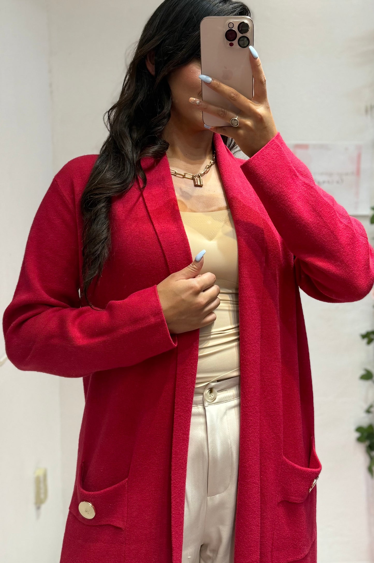 Suéter largo con bolsas y botones