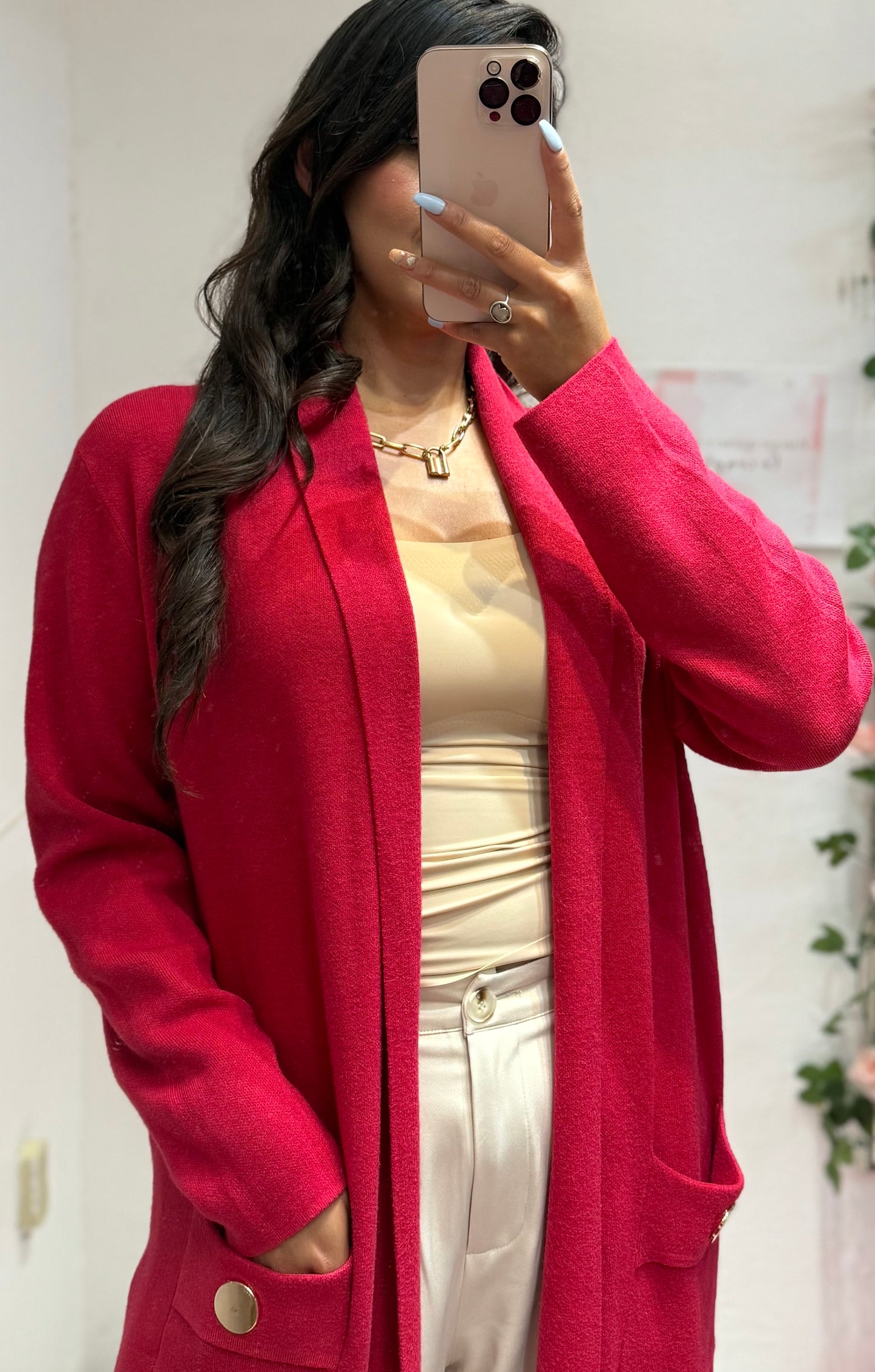 Suéter largo con bolsas y botones