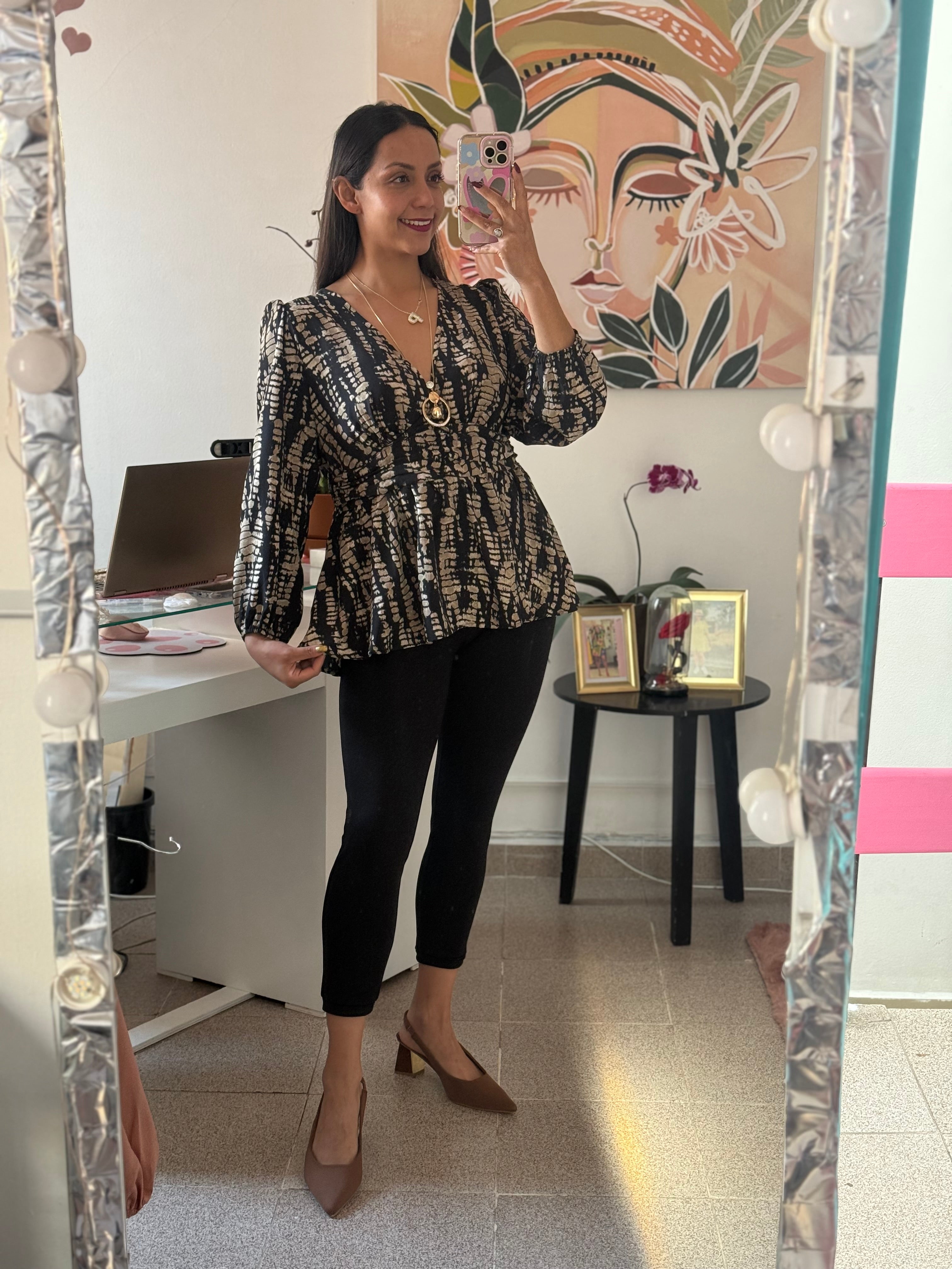 Blusa corte peplum estampada manga larga