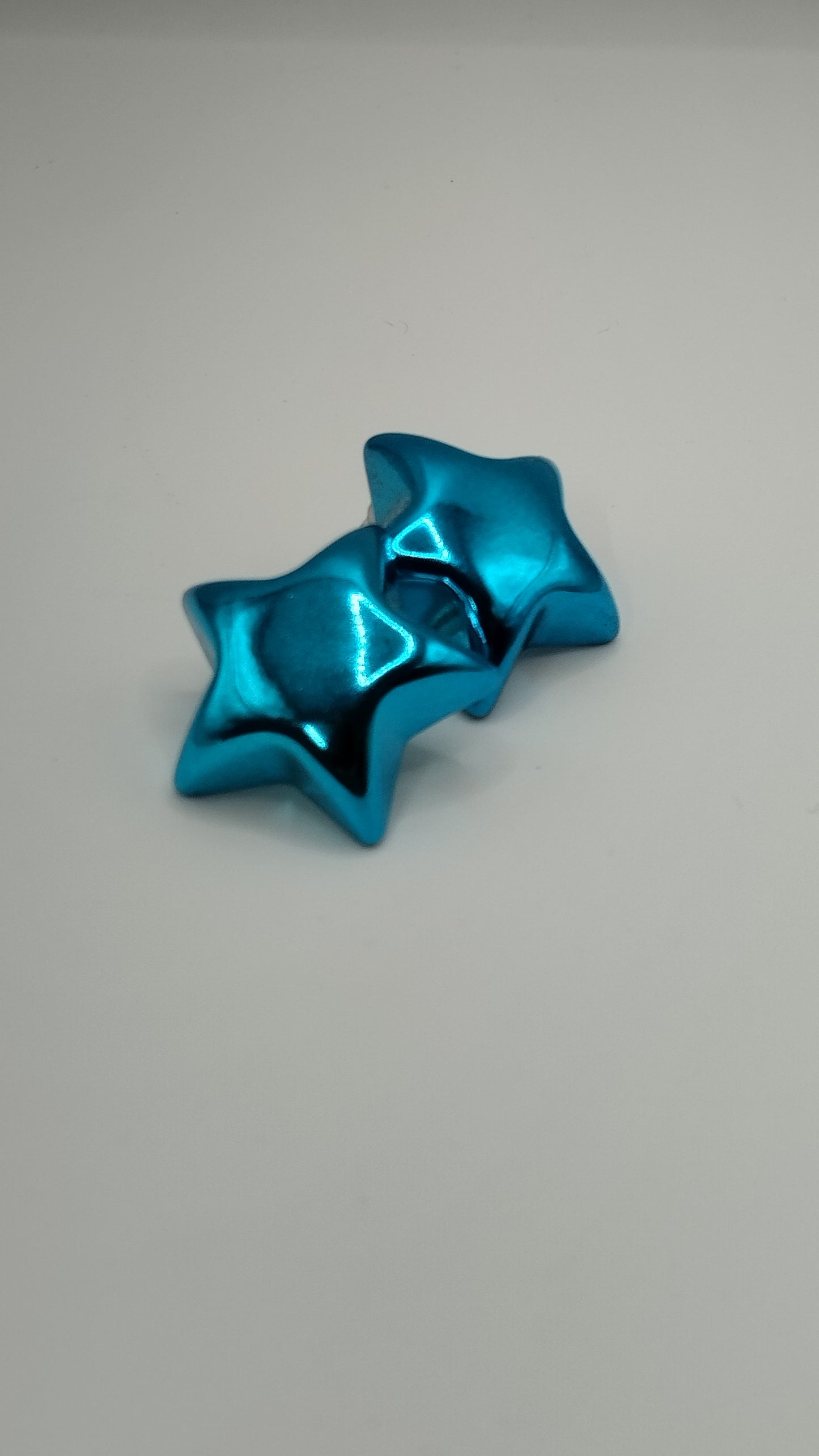 Aretes de estrella metálicos